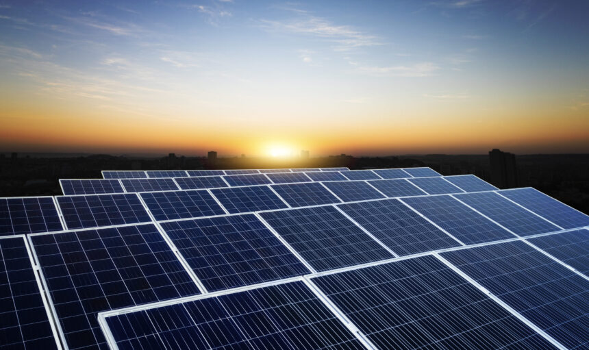 Solar energy power plant over a beautiful cloudy sky. Space For Text.